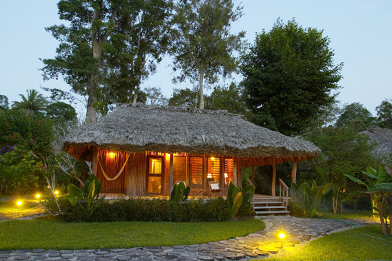 chan chich lodge, belize, thatched roof cabanas in the heart   of the Mayan empire in Belize and the tropical jungle 
in Belize.