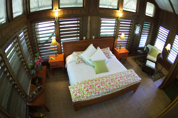 chan chich lodge, belize, thatched roof cabanas in the heart   of the Mayan empire in Belize and the 
tropical jungle 
in Belize