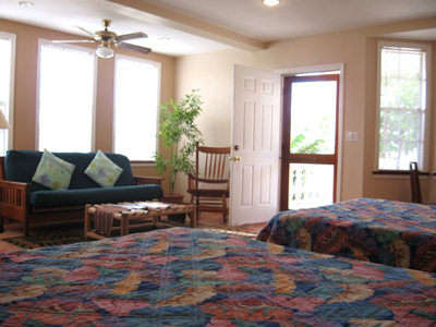 inside a deluxe room at The Iguana Reef Inn, the premier hotel on Caye Caulker in Belize, is ideal for experiencing the spectacular Scuba, diving, snorkeling, fishing and windsurfing at the Belize barrier reef.