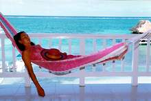 Your vacation escape to the tropics! Located right on the beach, in the heart of San Pedro on the beautiful island of Ambergris Caye, Belize.  All of San Pedro's small town charms await you at the doorstep. You'll be cooled by the trade winds off a coral blue Caribbean Sea while enjoying the peace of your own private balcony overlooking the longest coral reef in the western hemisphere.