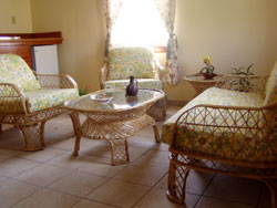 Living room at Royal Caribbean Resort hotel, Ambergris Caye, Belize. Where silky sea breezes always blow. 20 acre beach front resort with 45 Cabana Suites and private virgin beach. Unparalleled Caribbean views, magnificent coral reef and cove outside your door. Affordable and conveniently located only 1 mile south of San Pedro town.