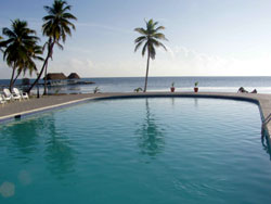 Pool at Royal Caribbean Resort hotel, Ambergris Caye, Belize. Where silky sea breezes always blow. 20 acre beach front resort with 45 Cabana Suites and private virgin beach. Unparalleled Caribbean views, magnificent coral reef and cove outside your door. Affordable and conveniently located only 1 mile south of San Pedro town.