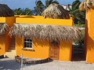 Caye Caulker Belize - Seaside Cabanas - Picturesque thatch-roofed, cabanas 50 feet from the Caribbean in beautiful Caye Caulker, Belize. Cabanas come with private bath, personal refrigerator, coffee maker, phone and cable TV.